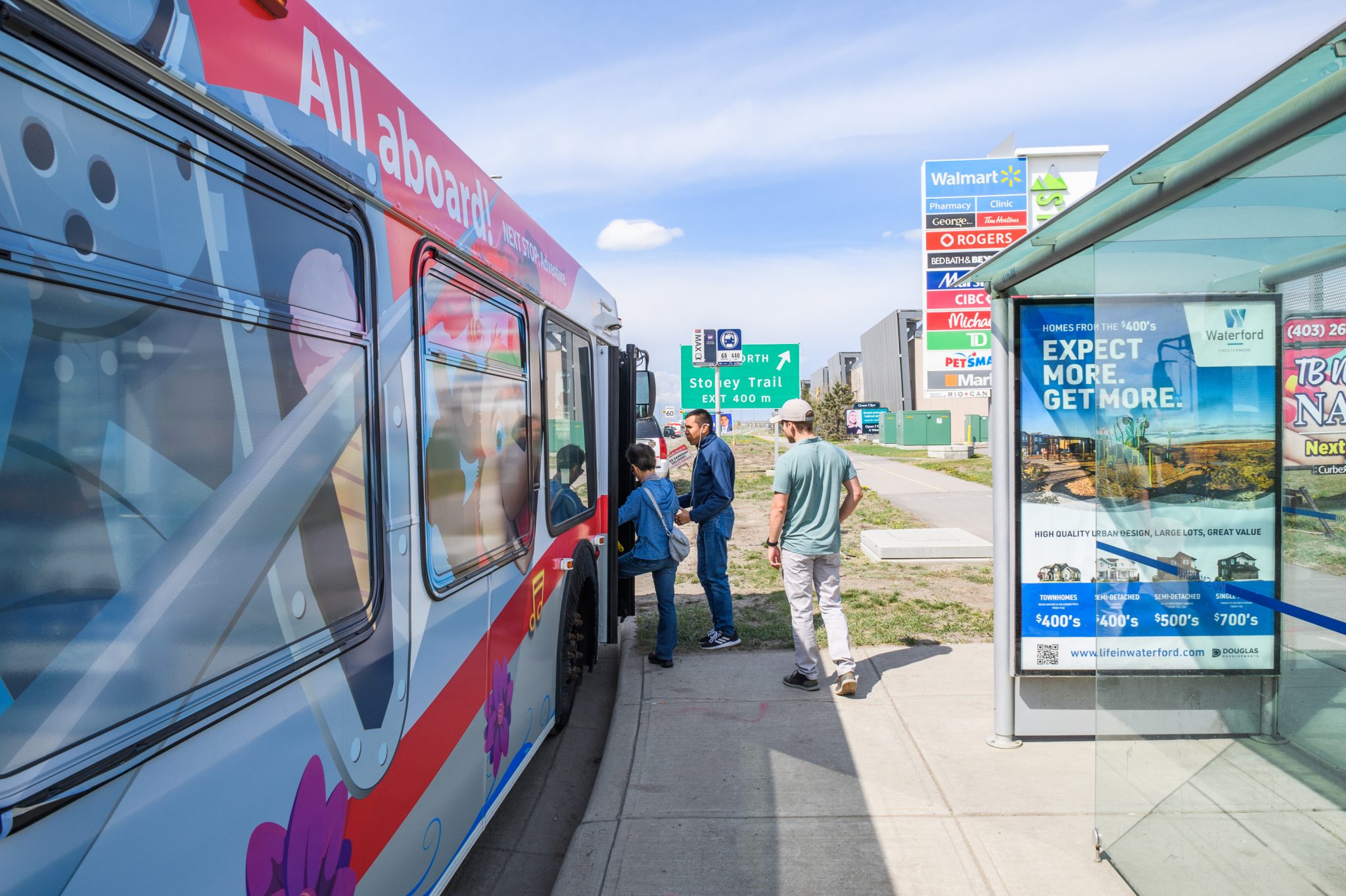 Transit bus with people getting on