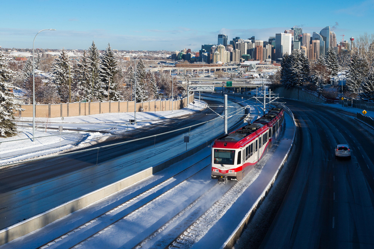 Example of where ballast tracks are used in Calgary, with a train operating on a snowy day.